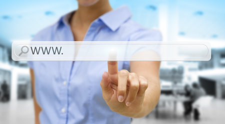 Businesswoman cliking on tactile interface web address barÂ 