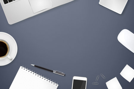 Workplace with tablet computer and mobile phone on table