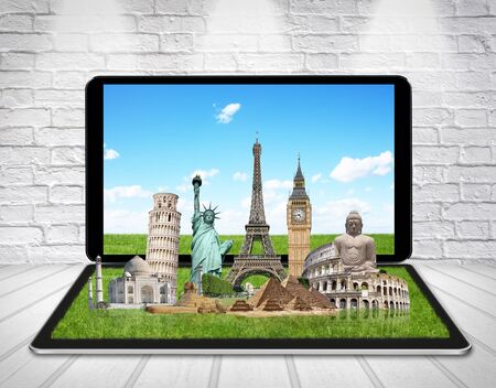 Famous monuments of the world grouped together on a digital tabletの写真素材