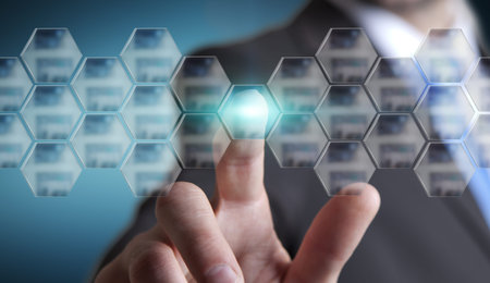 Businessman using digital interface with his fingers in his office