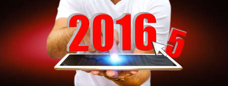 Man holding 2016 icons for the new yearの写真素材