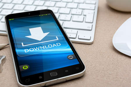 Workplace with modern mobile phone on table close-upの写真素材