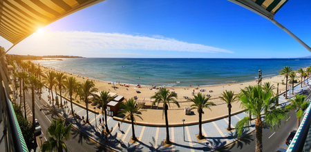 View of Salou Platja Llarga Beach in Spain from the last floor of a coast buildingの写真素材