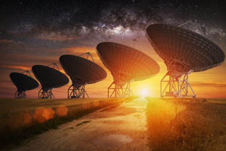 Satellite dish view at night with milky way in the skyの写真素材