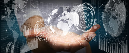 Businessman using futuristic screens with world and chartsの写真素材