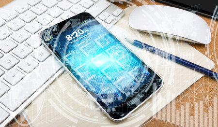 Numerous charts, screens and graphics over mobile phone in office