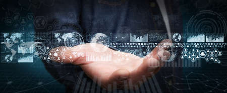 Businessman in his office during a presentation with charts screensの写真素材