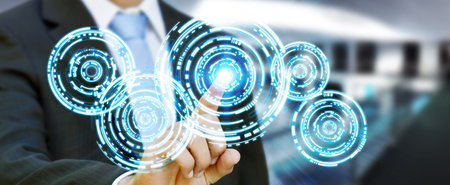 Businessman in his office pushing digital tactile circle technology screens