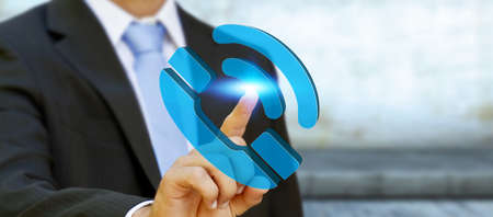 Businessman holding blue phone icon in his handの写真素材