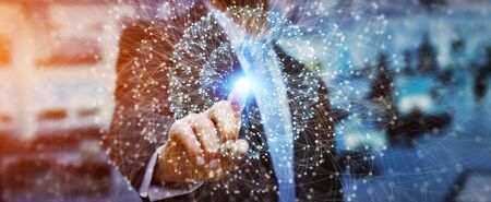 Businessman in office using digital data networkの写真素材