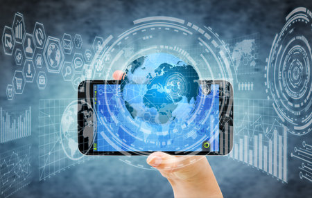Businesswoman using digital tactile charts screen with his mobile phone