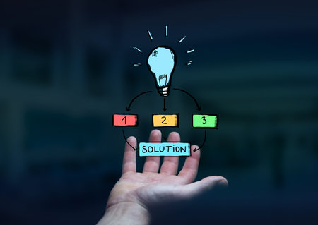 Businessman holding hand drawn lightbulb in his hand