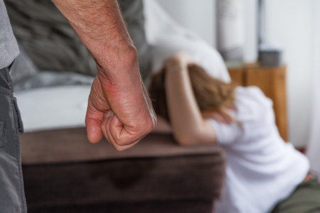 Man beating up his wife illustrating domestic violence