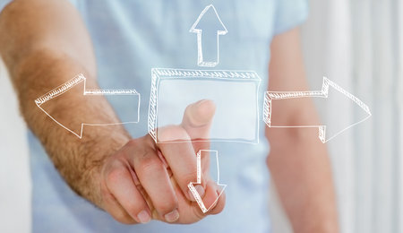 Man touching hand-drawn business presentation iwith his finger on blurred background