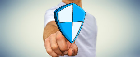 Businessman touching hand drawn shield safe protection in his hand