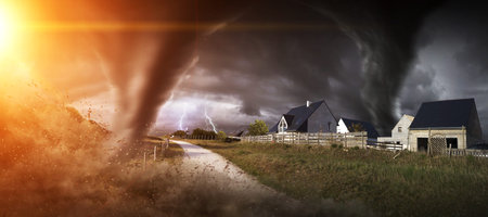 View of a large tornados destroying the landscape and city