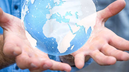 Businessman holding digital tactile world in his hand 3D renderingの写真素材