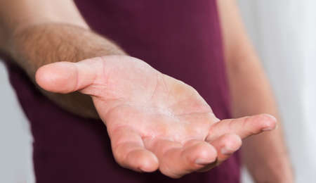Empty businessman hand on clear office backgroundの写真素材