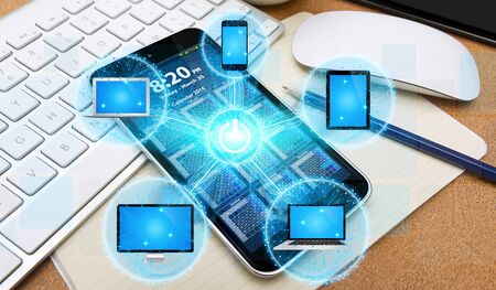 Colorful tech devices interacting with each other in modern officeの写真素材