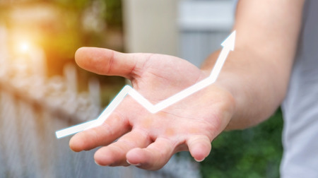 Businessman holding digital arrow in his hand 3D renderingの写真素材