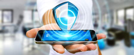 Businessman holding shield safe protection in his handの写真素材