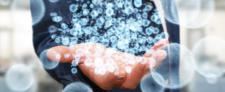 Businessman on blurred background holding 3D rendering data network sphere in his handの写真素材