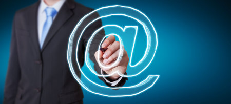 Businessman on blurred drawing manuscript contact icon with a penの写真素材