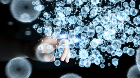 Businesswoman on blurred background touching 3D rendering data network sphere with her fingersの写真素材