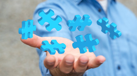 Businessman holding flying puzzle pieces in his hand â€˜3D renderingâ€™