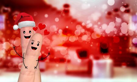 Happy finger family celebrating christmas on red backgroundの写真素材