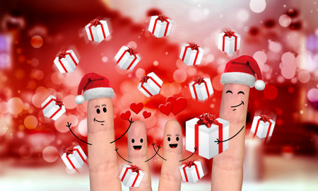 Happy finger family celebrating christmas on red backgroundの写真素材