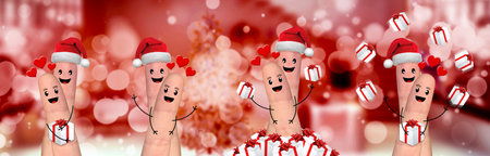 Happy finger family celebrating christmas on red backgroundの写真素材