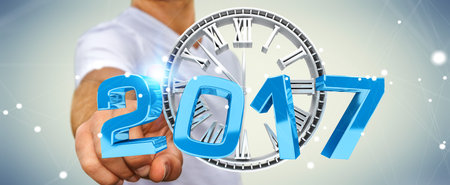 Businessman touching 2017 3D rendering text with clock with his finger