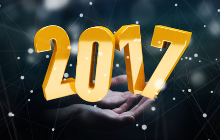 Businessman holding colorful 2017 3D rendering text in his hand