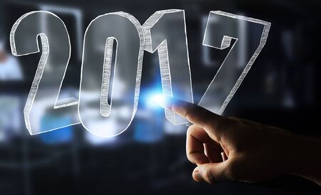 Businessman touching 2017 hand drawn text with his fingerの写真素材