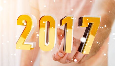 Businessman touching colorful 2017 3D rendering text with his fingerの写真素材