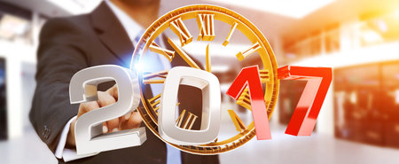 Businessman touching 2017 3D rendering text with clock with his finger