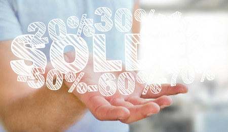 Businessman on blurred background holding sales icons in his hand 3D renderingの写真素材