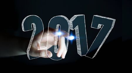 Businesswoman touching 2017 hand drawn text with her fingerの写真素材