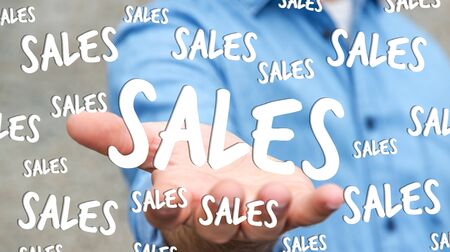 Businessman on blurred background holding sales icons in his hand 3D renderingの写真素材