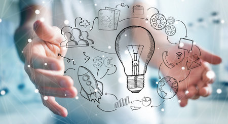 Businessman on blurred background holding manuscript project presentation with his handの写真素材