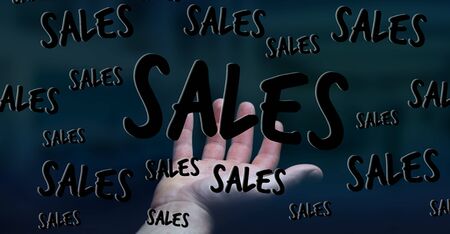 Businessman on blurred background holding sales icons in his hand 3D renderingの写真素材