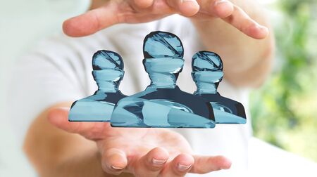 Businessman on blurred background holding shiny glass avatar group 3D renderingの写真素材
