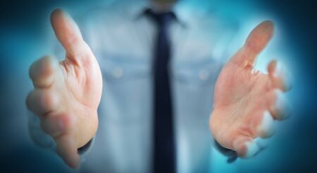 Businessman on blurred background showing his empty handの写真素材