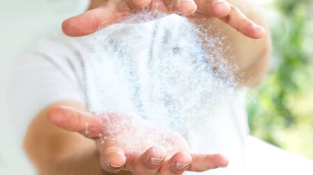Businessman on blurred background holding 3D rendering data network sphere in his handの写真素材