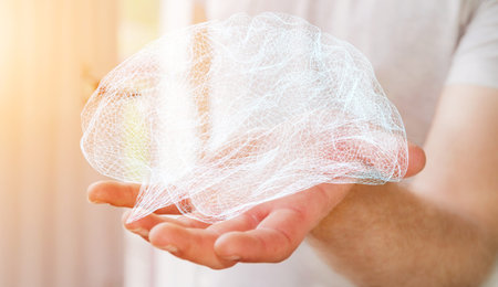 Businessman holding digital human brain with cell and neurons activity 3D rendering