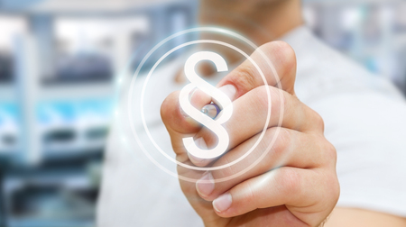 Businessman on blurred background using law protection right 3D renderingの写真素材