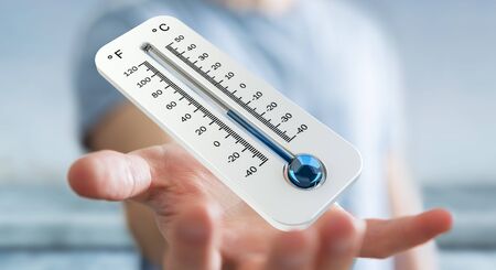 Businessman checking the temperature drop with a thermometer 3D renderingの写真素材