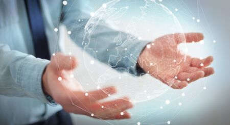 Businessman holding global network and data exchanges over the world 3D renderingの写真素材