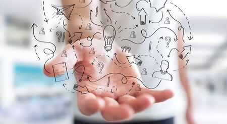 Businessman on blurred background holding manuscript project presentation with his handの写真素材